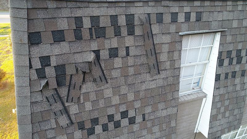 what missing shingles on a roofing system looks like example